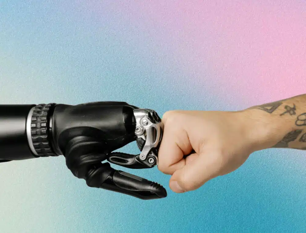 robot hand fist bumping a human hand